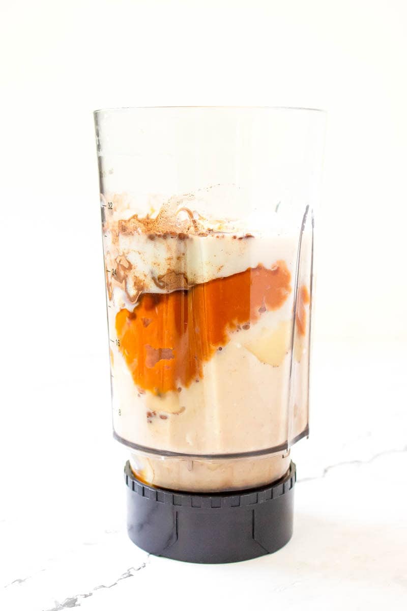 All the ingredients for the pumpkin pie smoothie in the blender.