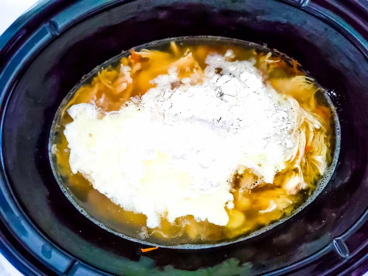 Cornstarch on top of chicken mixture in the slow cooker.