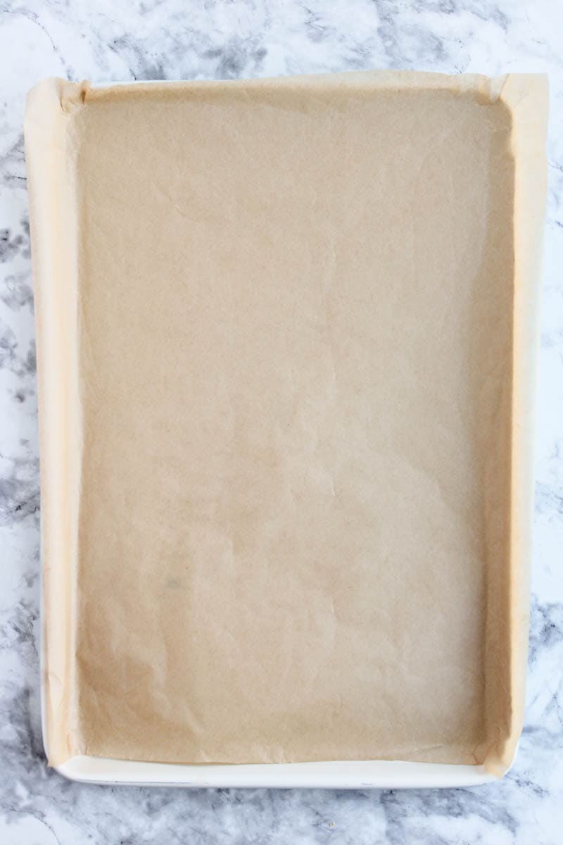Baking sheet with parchment paper on it.