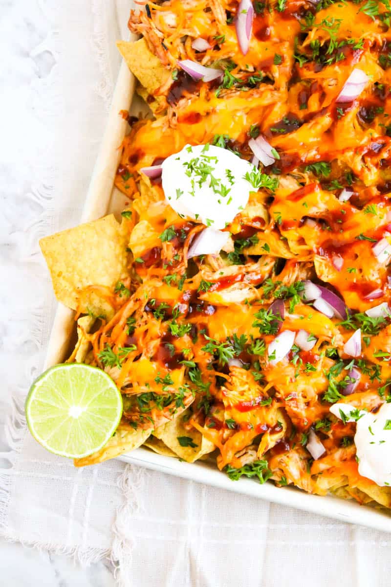 Left corner shot of sheet pan with bbq chicken nachos