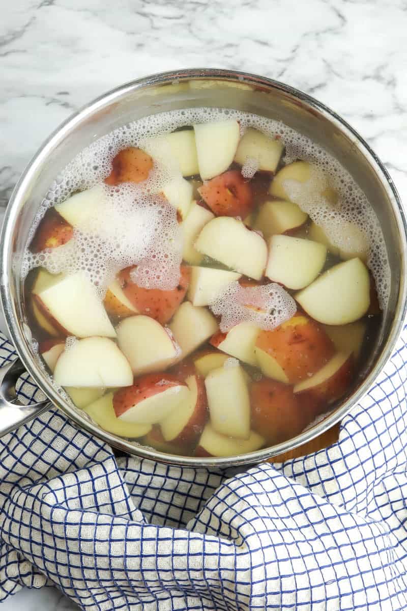 Pot with water and cut potatoes