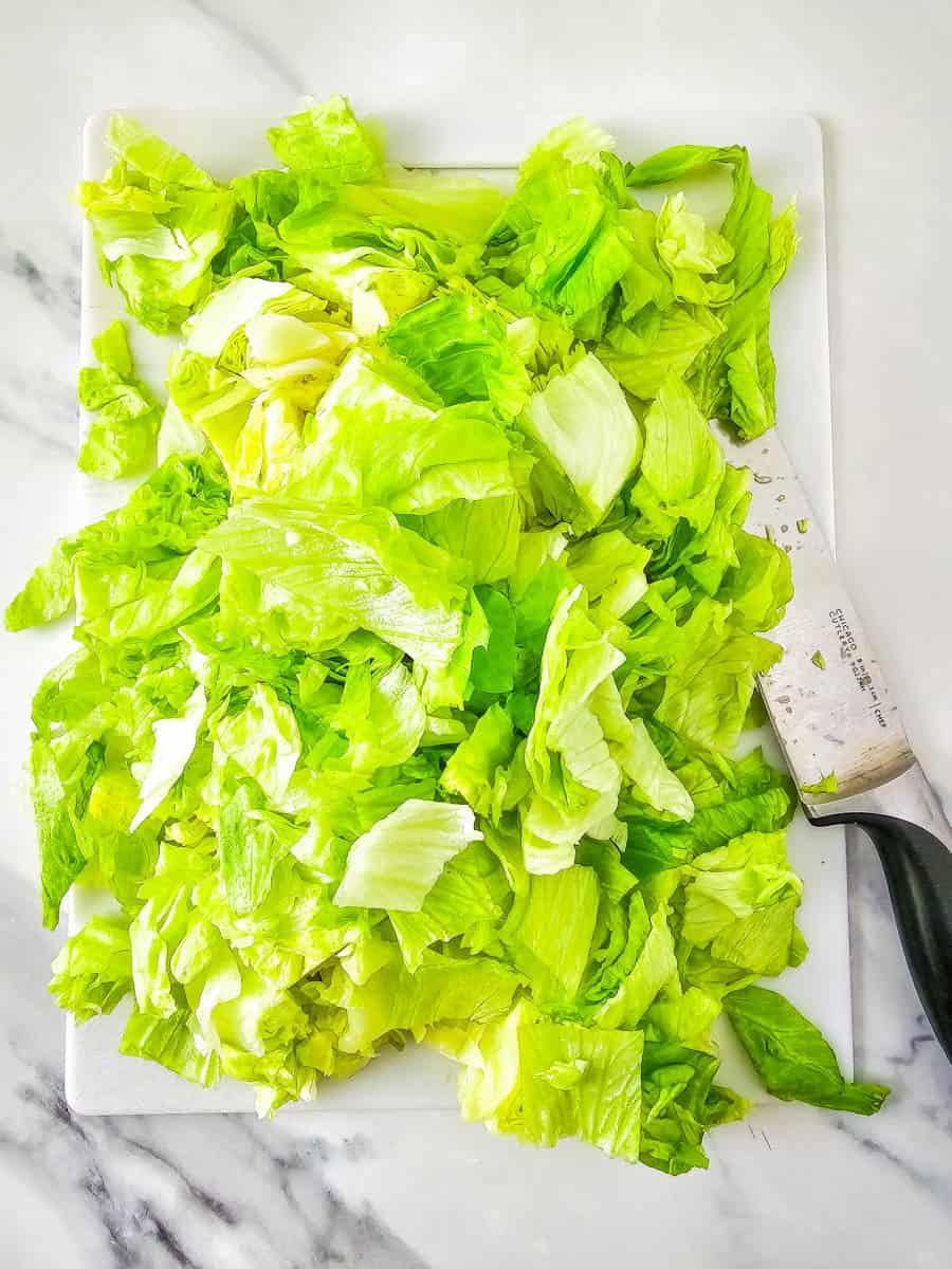 Chopped lettuce on a cutting board