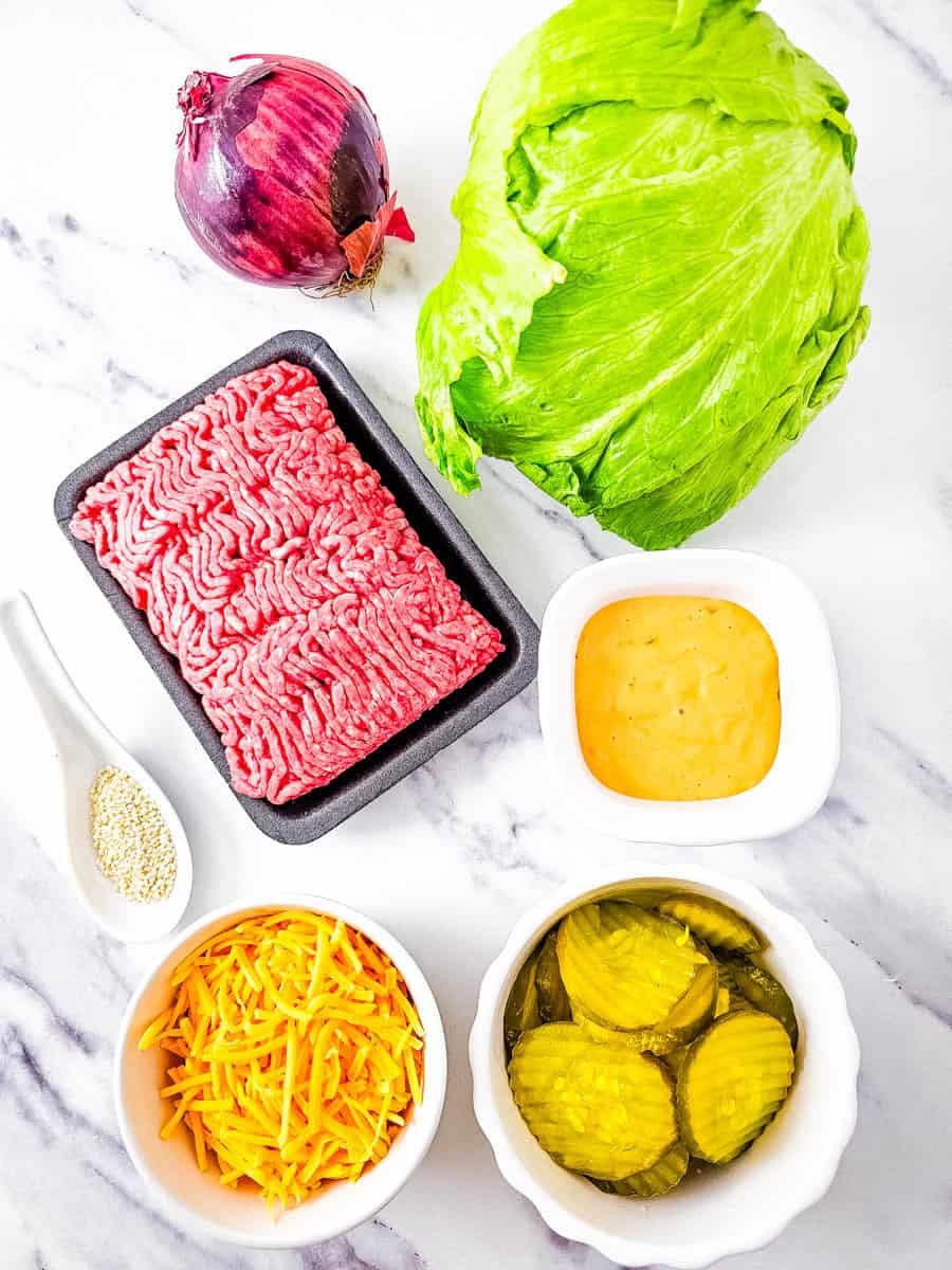 Big Mac Salad ingredients on white background.