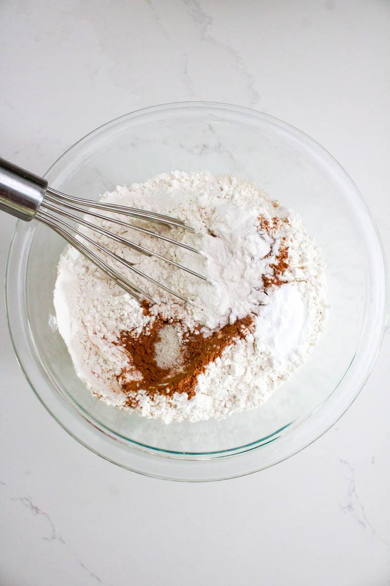 The dry ingredients being whisked in a bowl.
