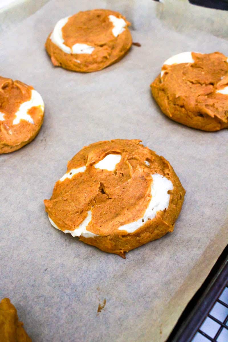 The pumpkin cheesecake cookies ready to bake on a baking sheet.