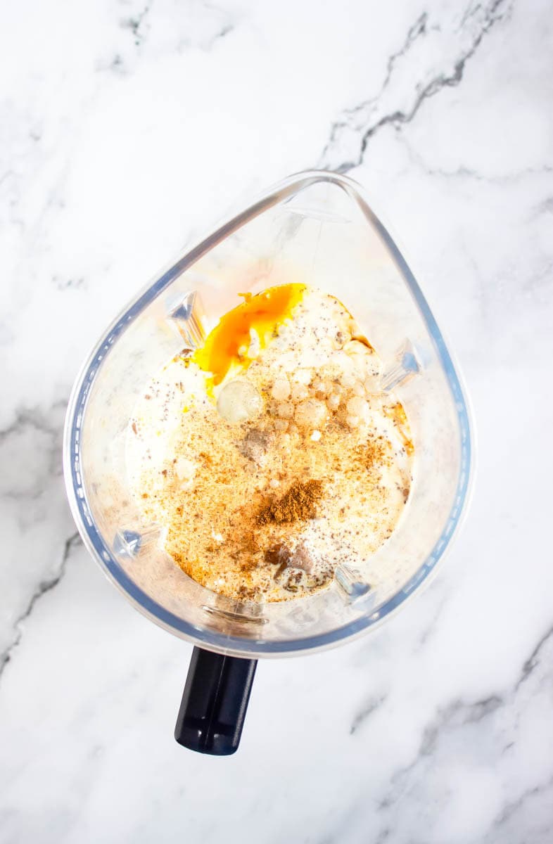 Ingredients for pumpkin spice eggnog in the blender.