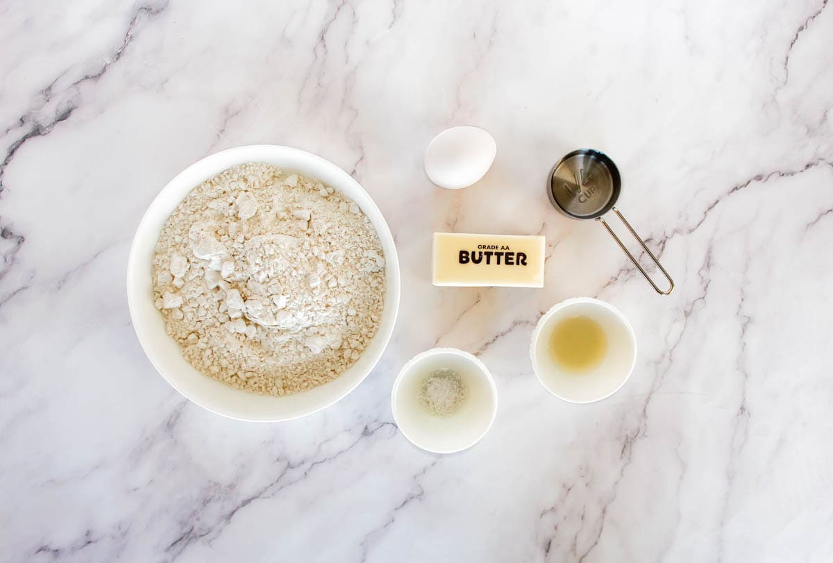 Ingredients for gluten free pie crust on marble top.