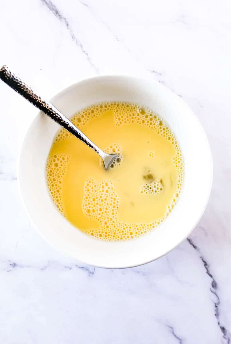 Bowl with egg, lemon juice and water mixed together. 
