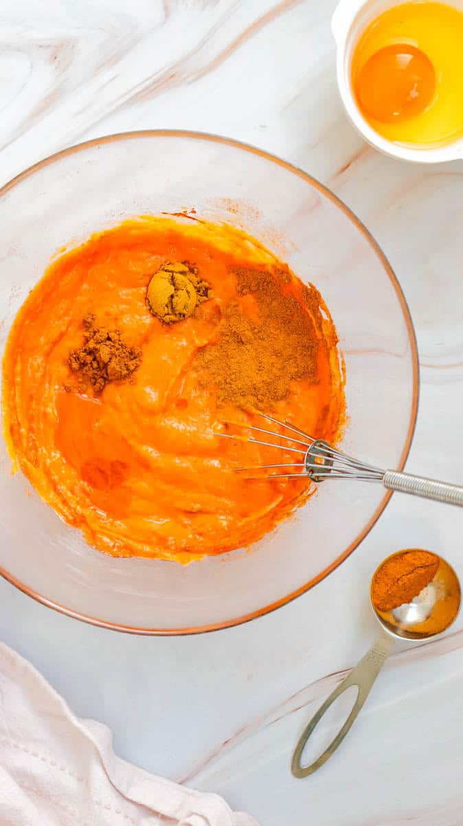 Bowl with pie filling ingredients in it with a whisk