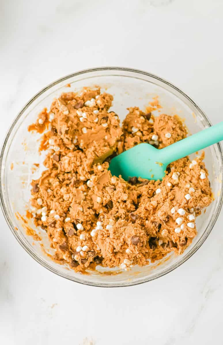 Chocolate chips and marshmallows in the cookie batter mixture.