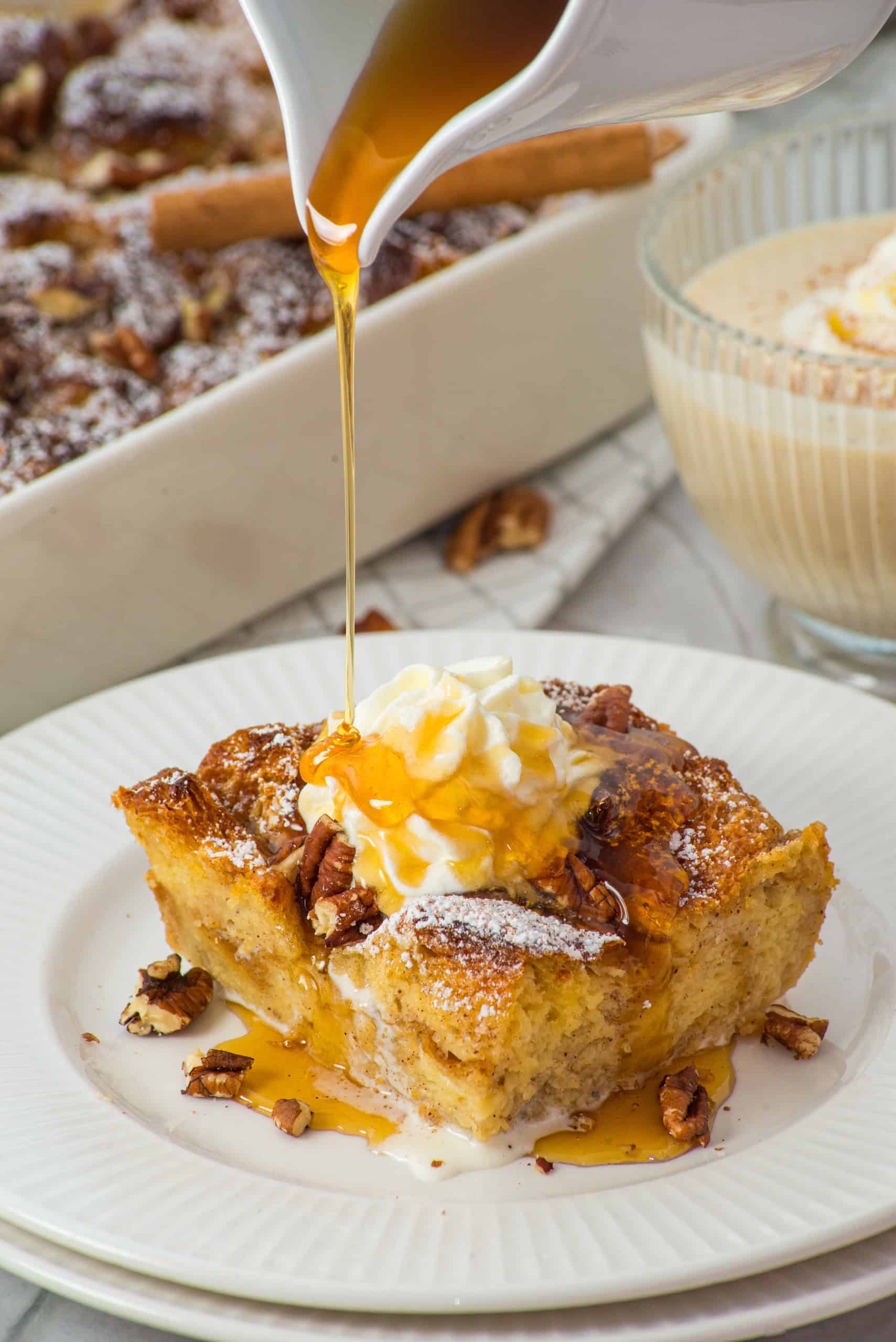 A piece of gluten free eggnog french toast casserole on white plate