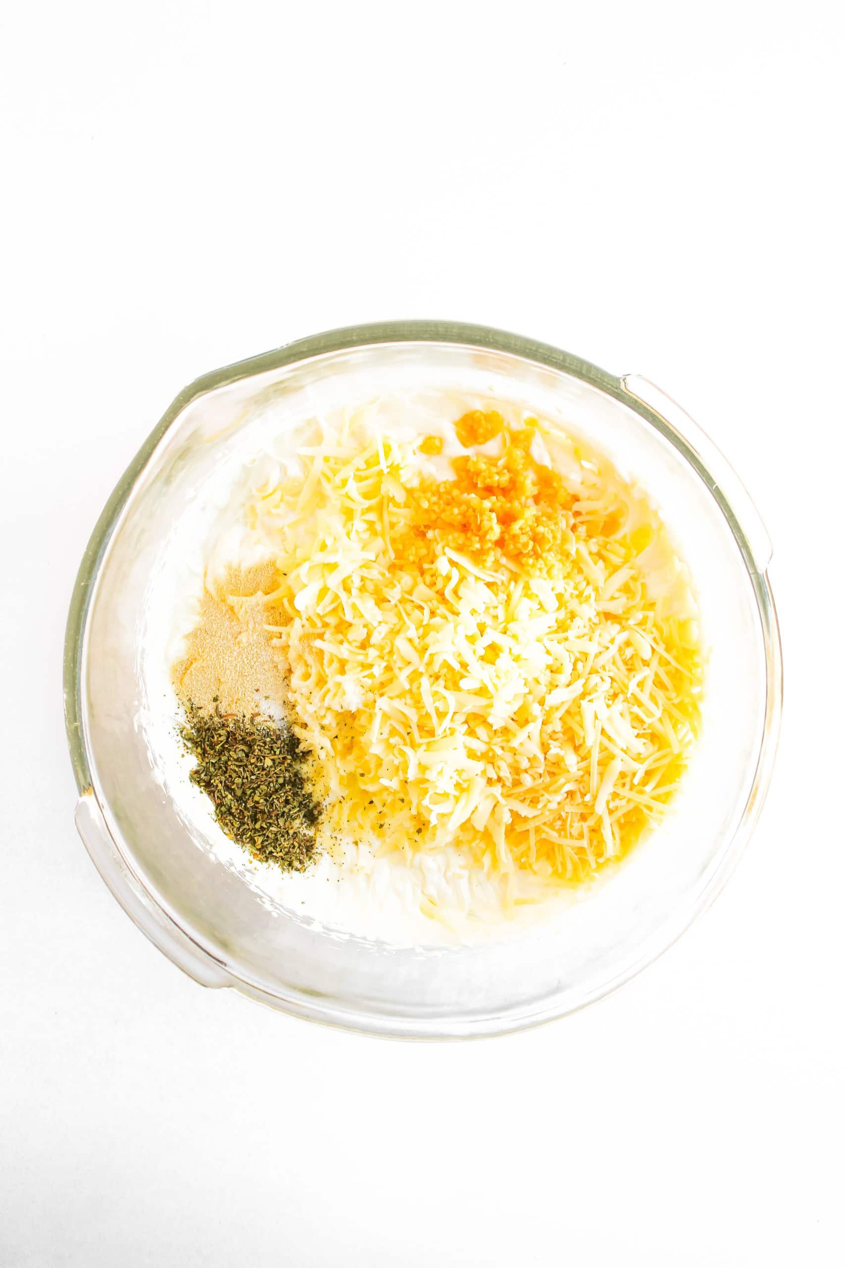 Seasoning, cheeses mixed with the cream cheese mixture.