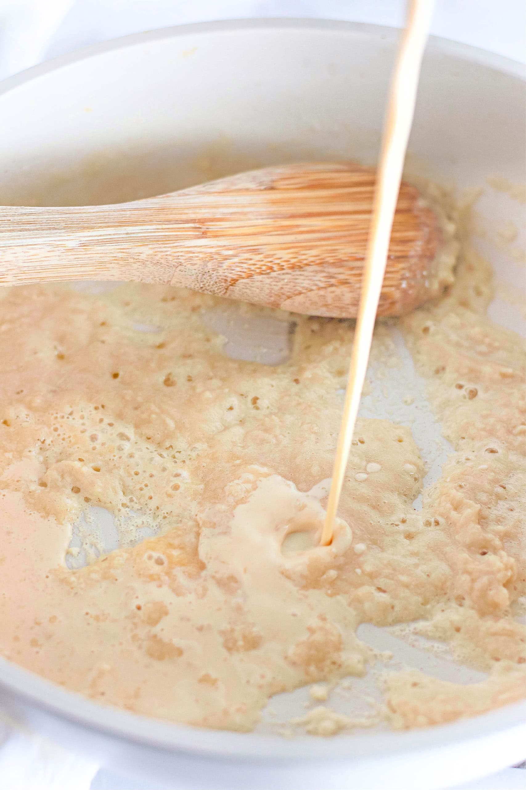 Butter, flour making a roux in a pan.