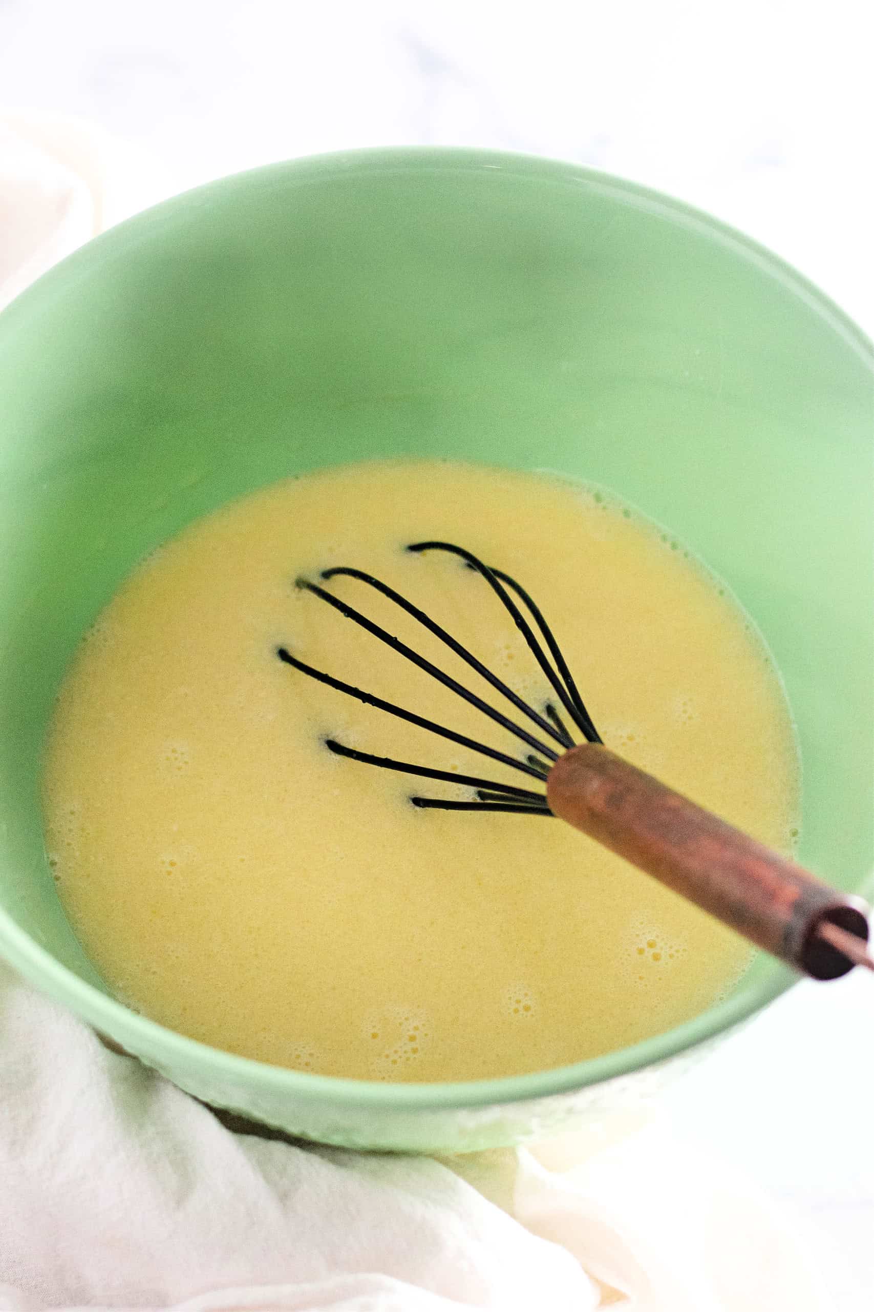 Wet ingredients for the gluten free chocolate cake in a mixing bowl