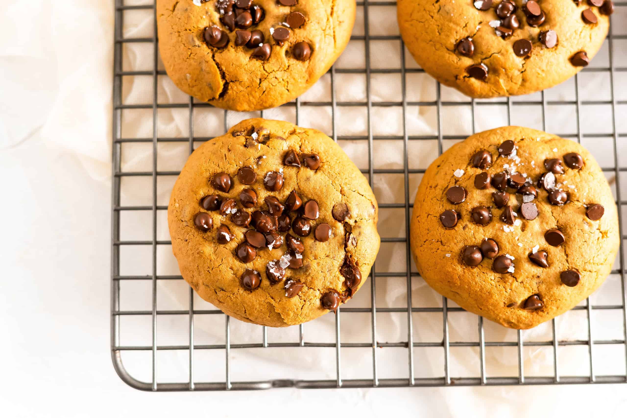 Gluten free chocolate chip cookies on a cooling rack