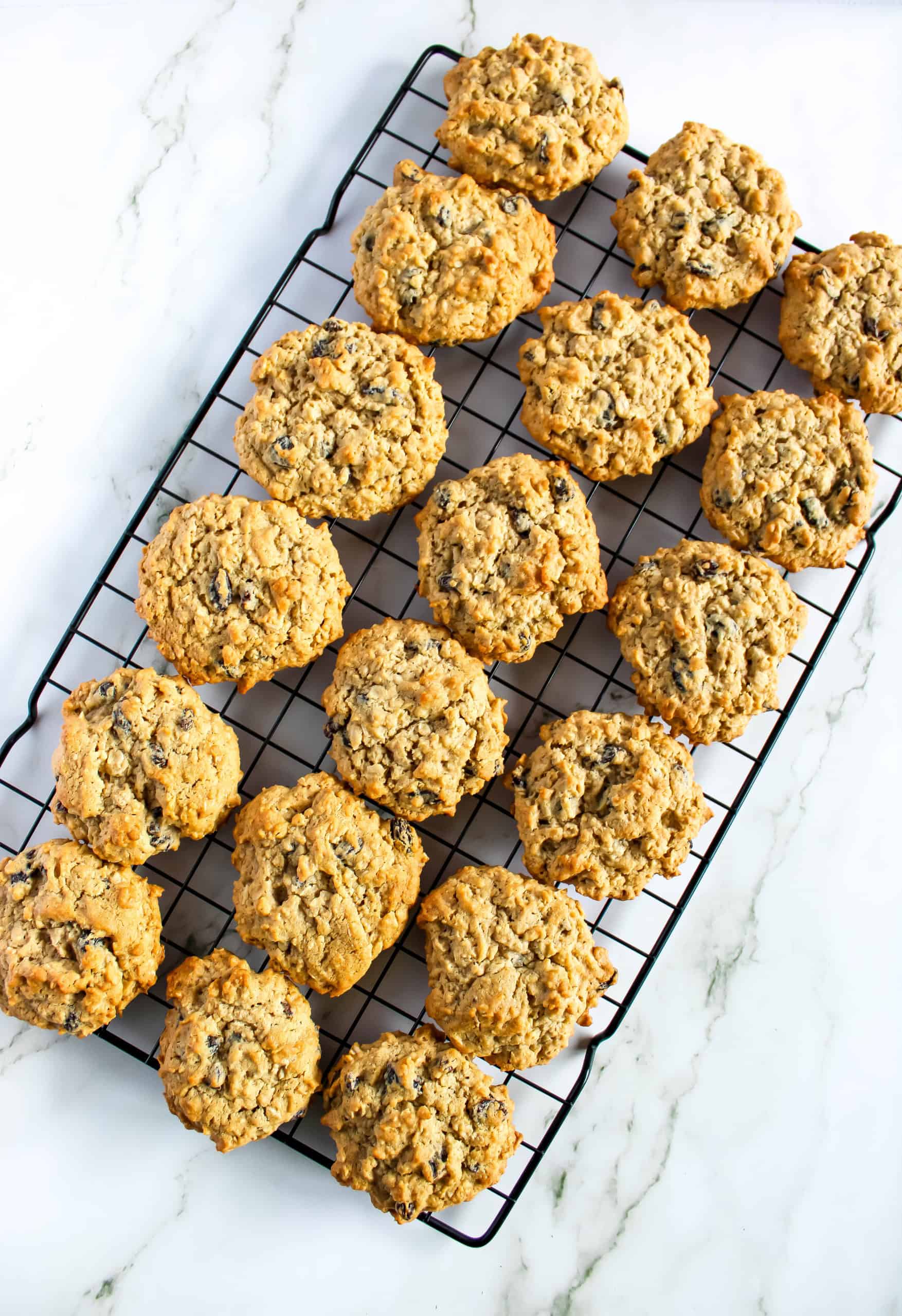 Gluten free oatmeal raisin cookies on a cooling rack.