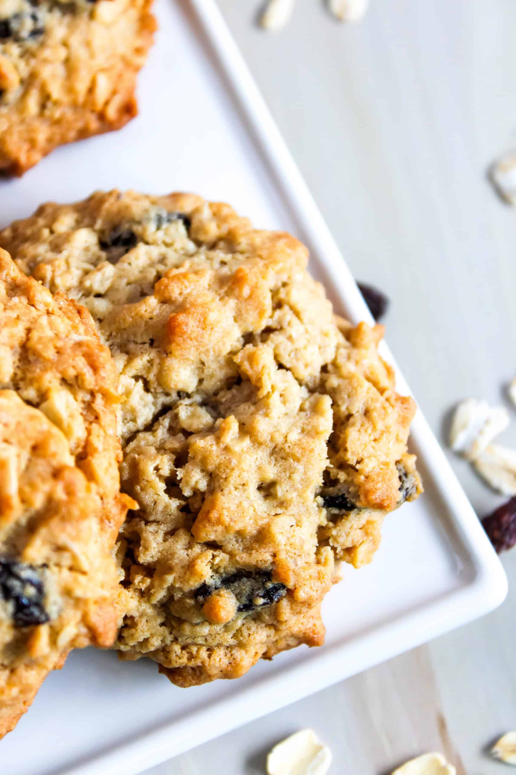Close up of the gluten free oatmeal raisin cookies on a white serving tray.