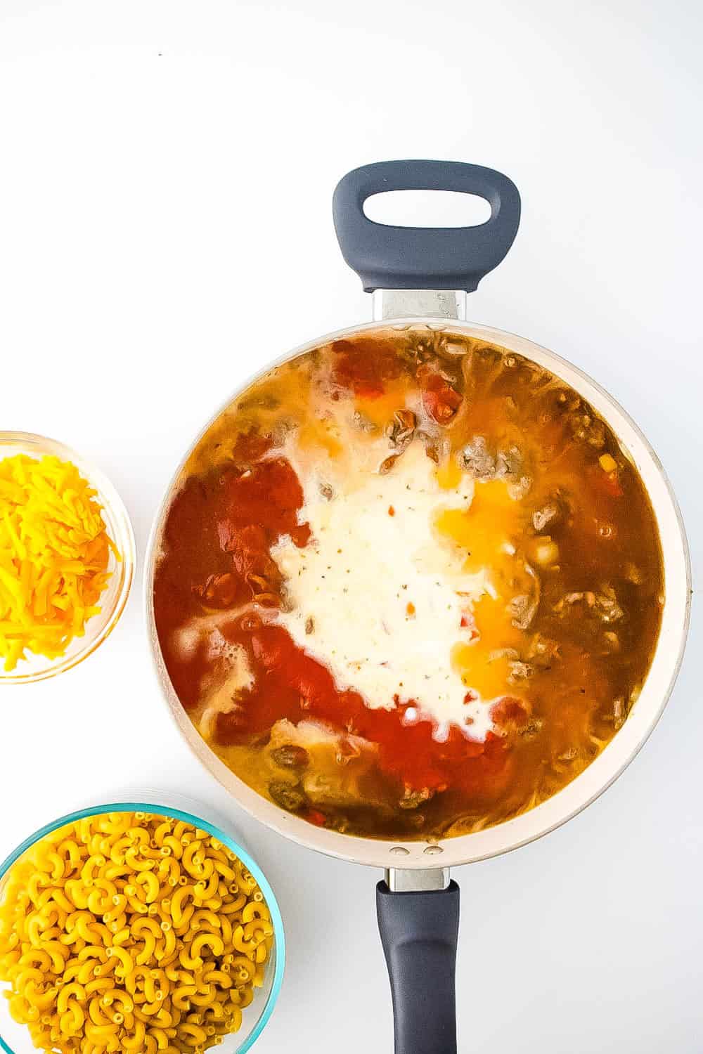 The liquid ingredients added to skillet with the meat, onions, peppers and garlic.