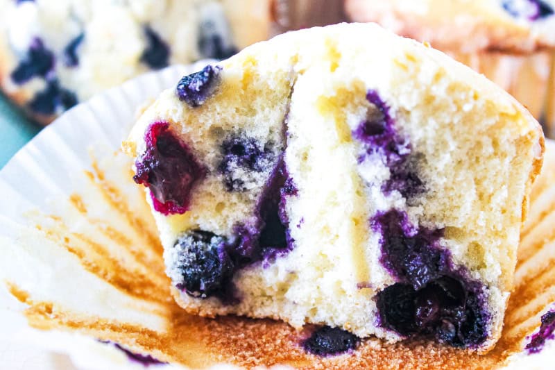 A close up of an open gluten free blueberry muffin