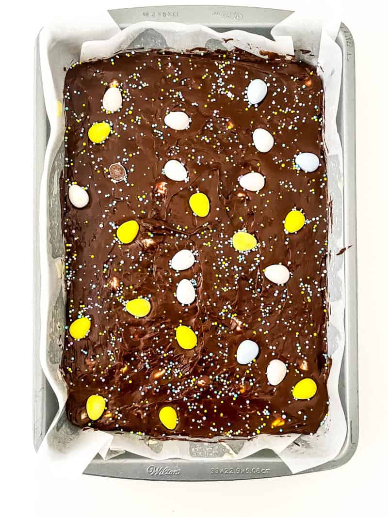 Chocolate layer added to white chocolate fudge layer in pan