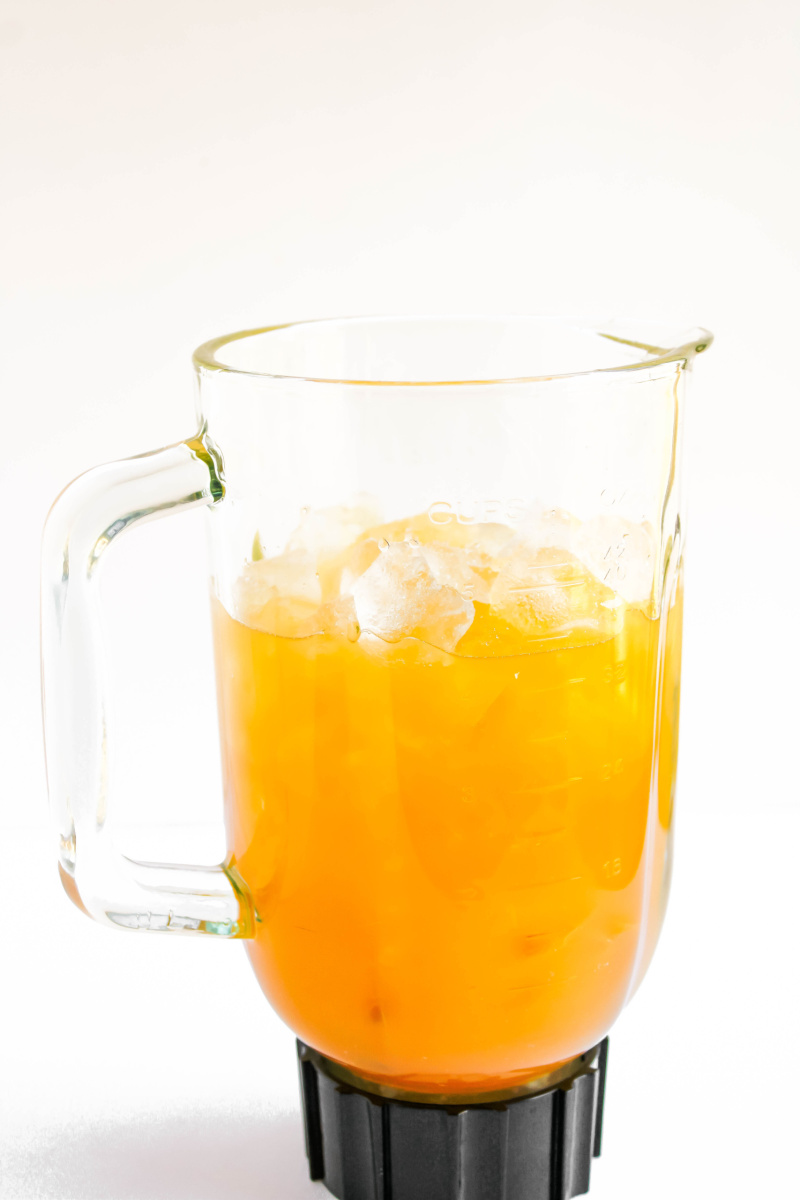 Blender with pineapple juice and coconut cream.