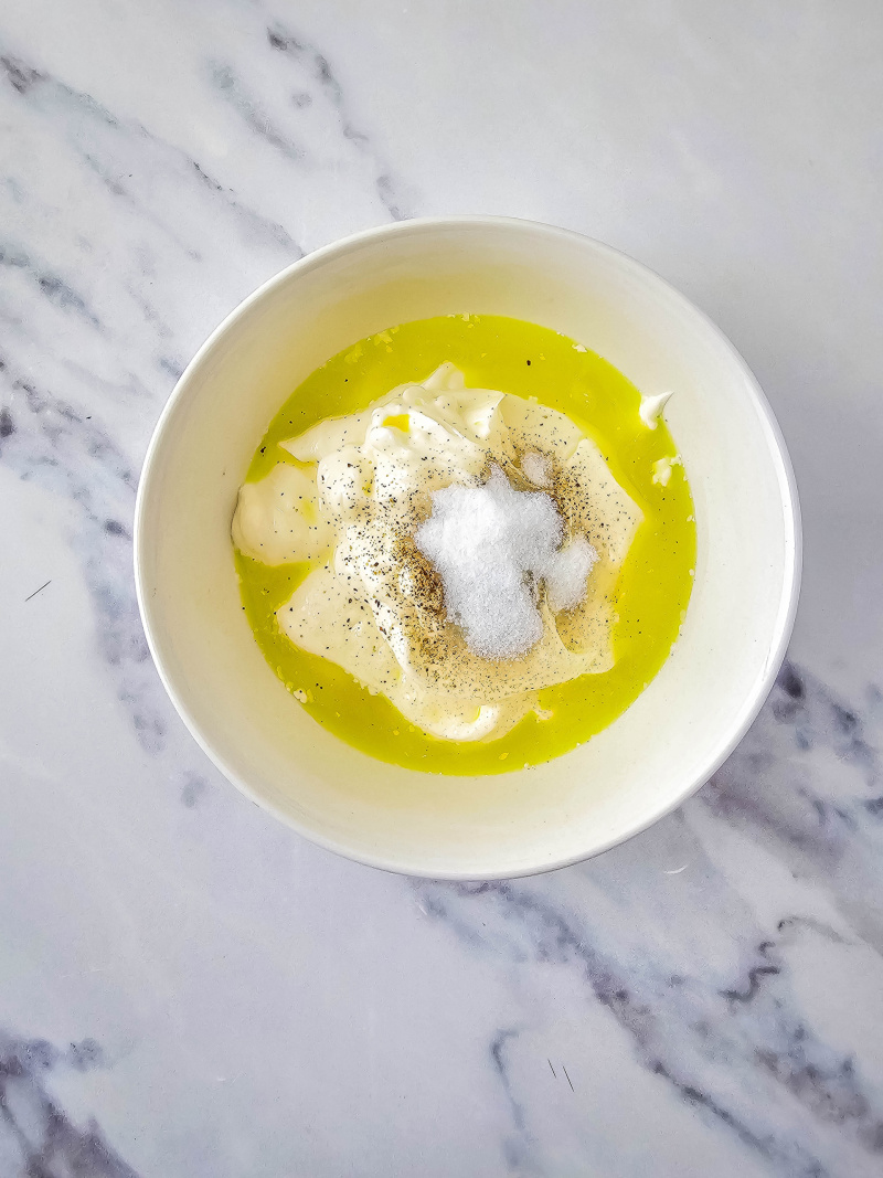 Bowl with mayo, sugar, pepper and pickle juice