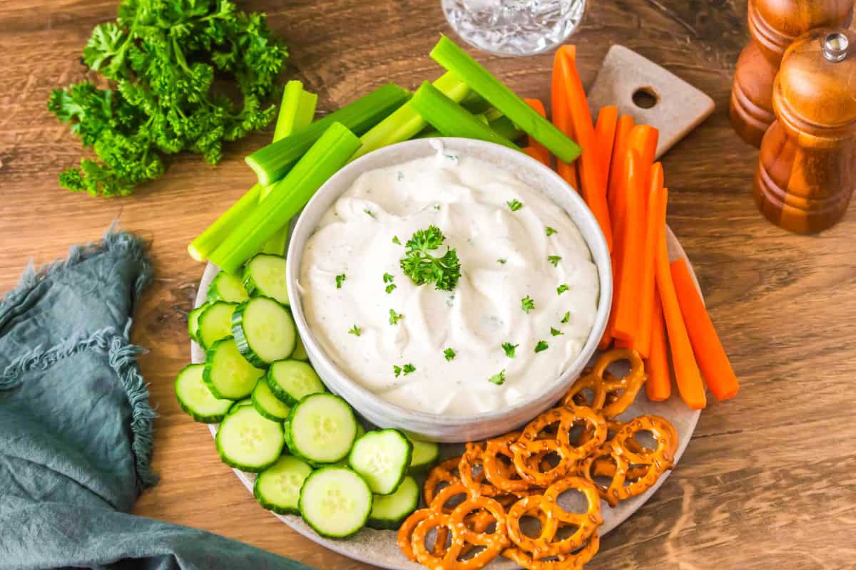 Cottage cheese ranch dip in bowl with veggies surrounding