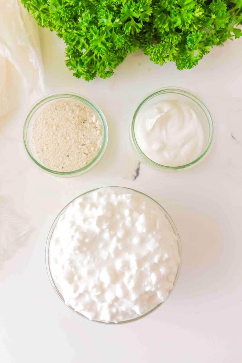 Ingredients in bowls for the cottage cheese ranch dip