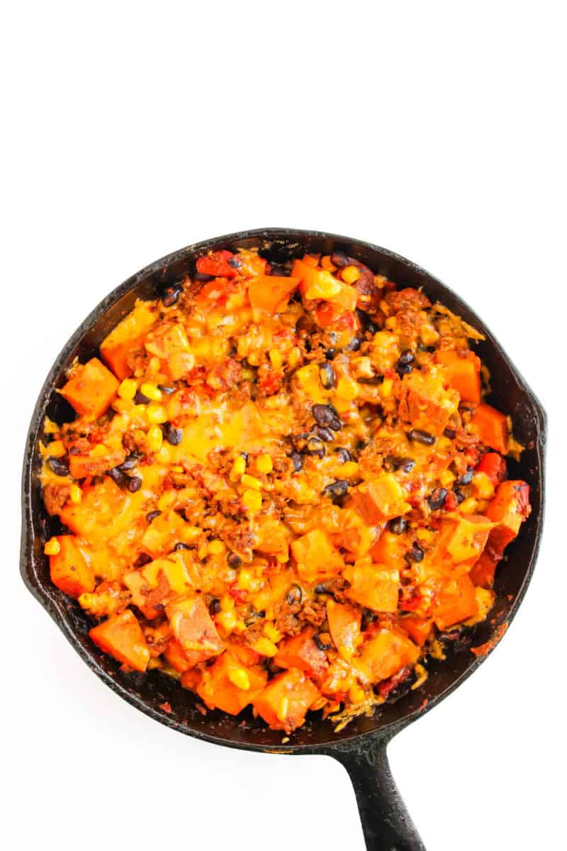 Sweet potato taco skillet with melted cheese on top