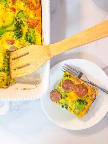 Casserole dish with wooden spatula and plate with slice and fork