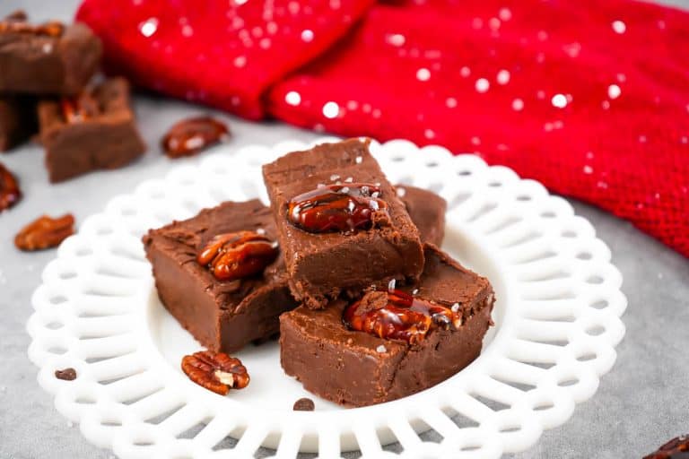 Fudge on white plate with red dish towel