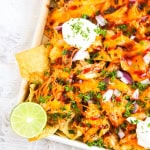 Left corner shot of sheet pan with bbq chicken nachos