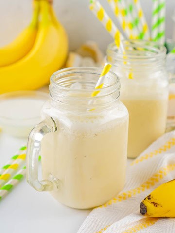 Two glass jars with banana milk