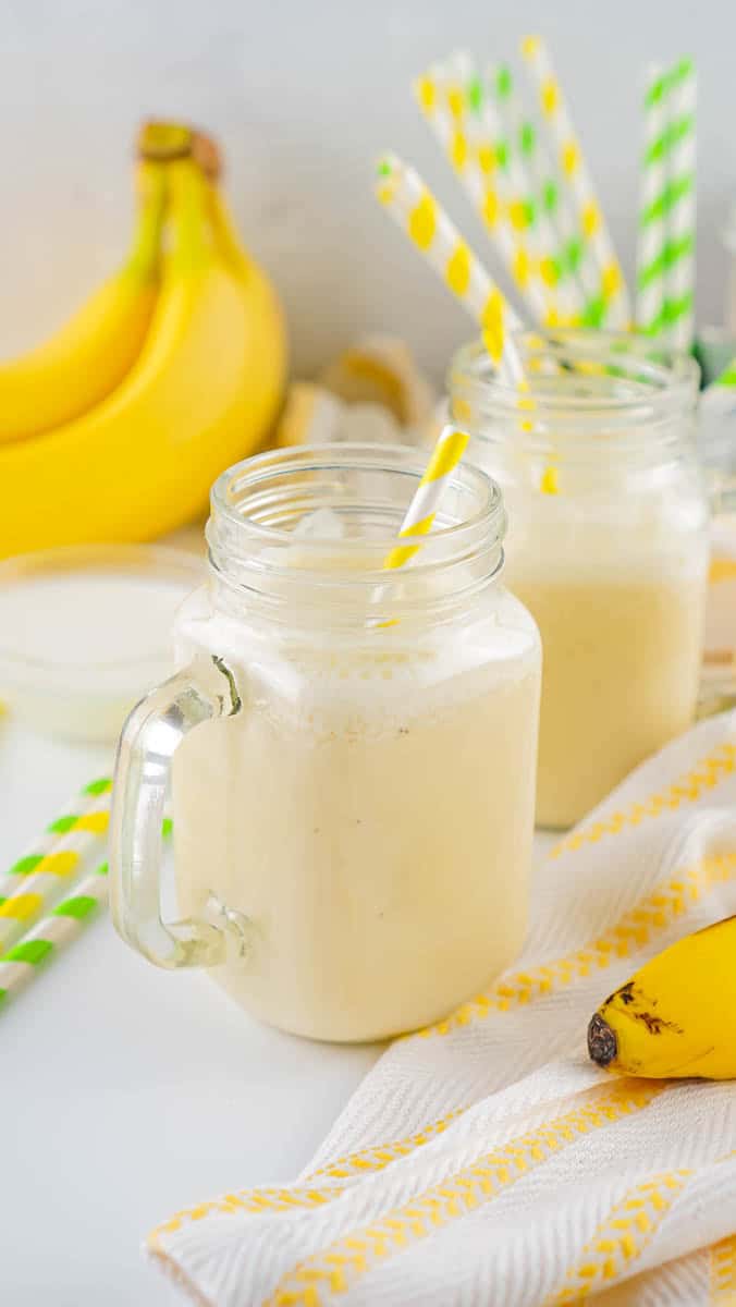 Two glass jars with banana milk