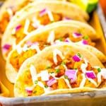 A close up of three tacos.