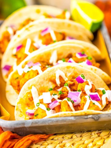 A close up of three tacos.