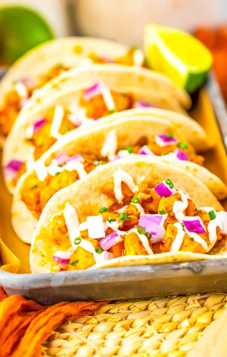 A close up of three tacos.