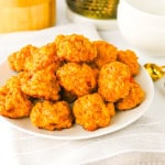 A white plate of stacked Rotel sausage balls