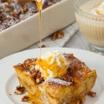 A piece of gluten free eggnog french toast casserole on white plate
