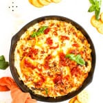 Marry Me Chicken dip in a cast iron skillet.