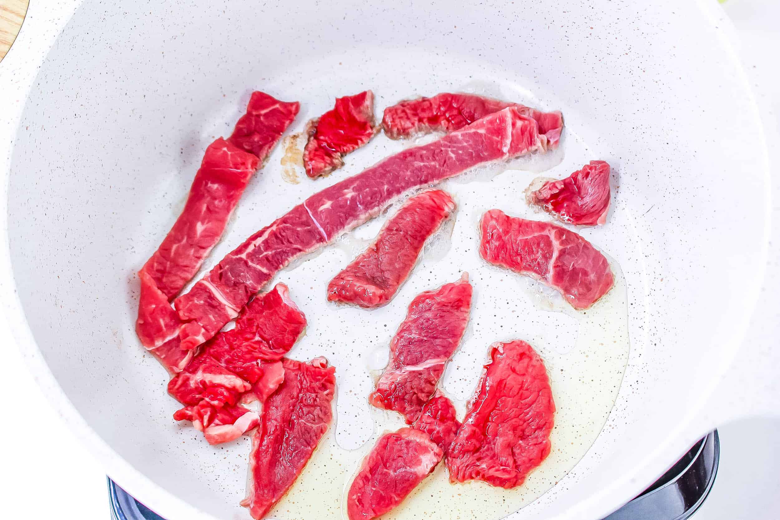 Searing beef in dutch oven.