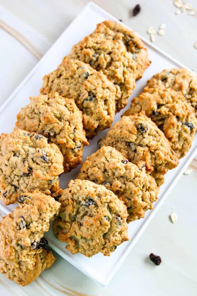 Gluten free oatmeal raisin cookies on a white platter.