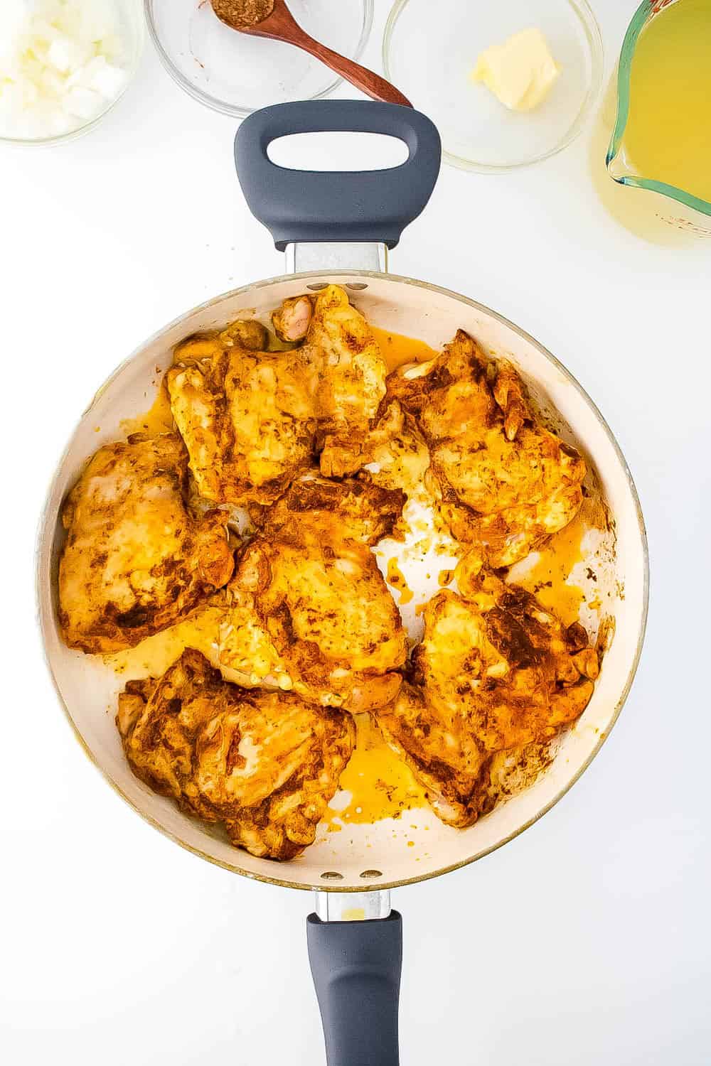 Chicken searing in a skillet