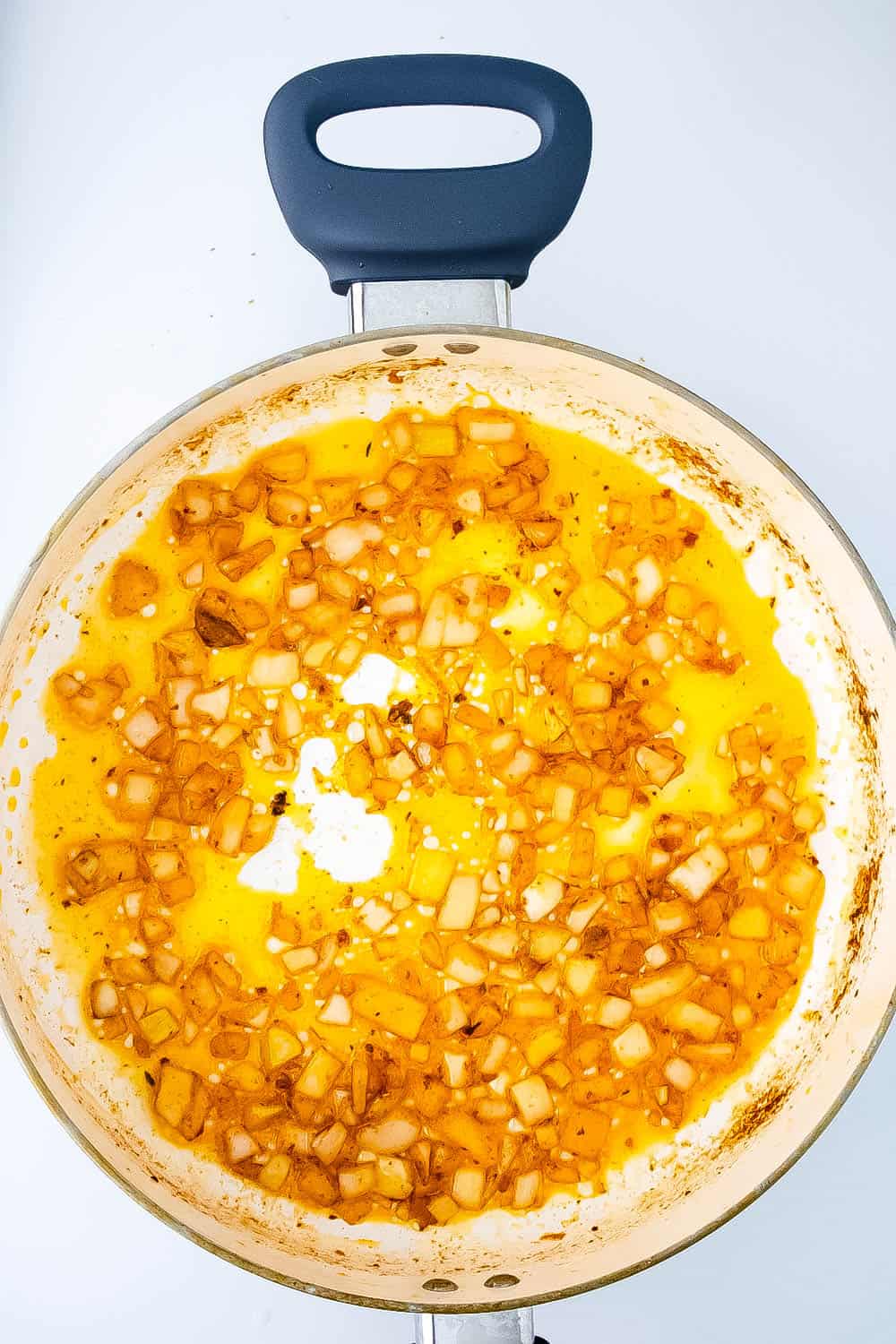 Butter and onions cooking in skillet