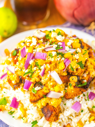A big white bowl with Mexican street corn chicken and rice.