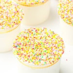 Four dessert cups with the dot cakes in them.